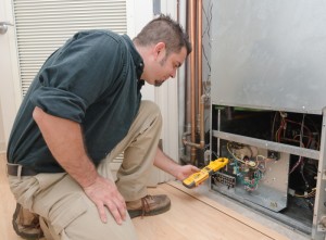 HVAC-Repair-Man-Checking-Heat-Pump