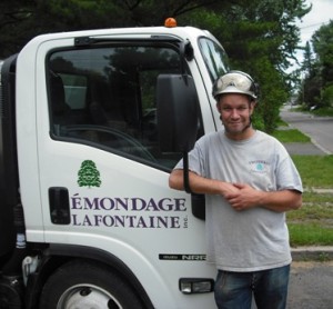 Marc Lafontaine owner of the tree service Émondage Lafontaine stands by his truck