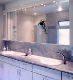 Pic of a bathroom counter showoing bathroom accessories