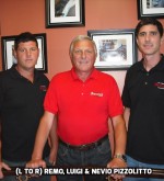 Owner of Spanish Ornamental staircases in a red t-shirt with his sons in black t-shirts standing up