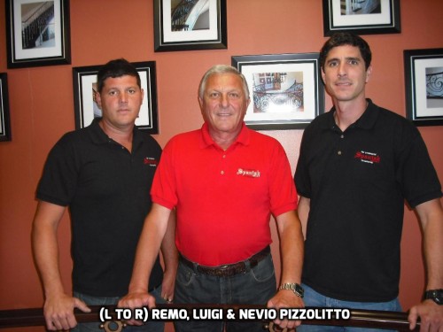 Owner of Spanish Ornamental staircases in a red t-shirt with his sons in black t-shirts standing up