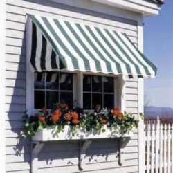 Greeen and white stripes awnings installed over a window with a flower box under
