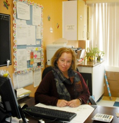 Adela Szulzinger sitting in her office at le Centre Éducatif La Sagesse